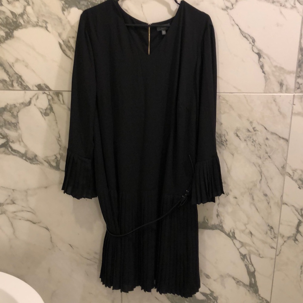 Black dress with ruffle sleeves and ruffled bottom